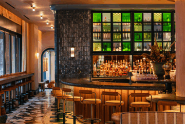 Modern bar interior with warm lighting and seating