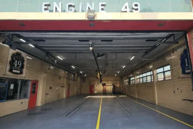 Interior of fire station garage labeled Engine 49
