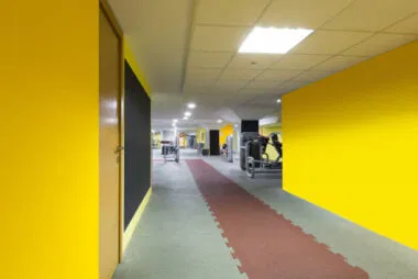 Durable interlocking sport flooring system in a commercial athletic facility