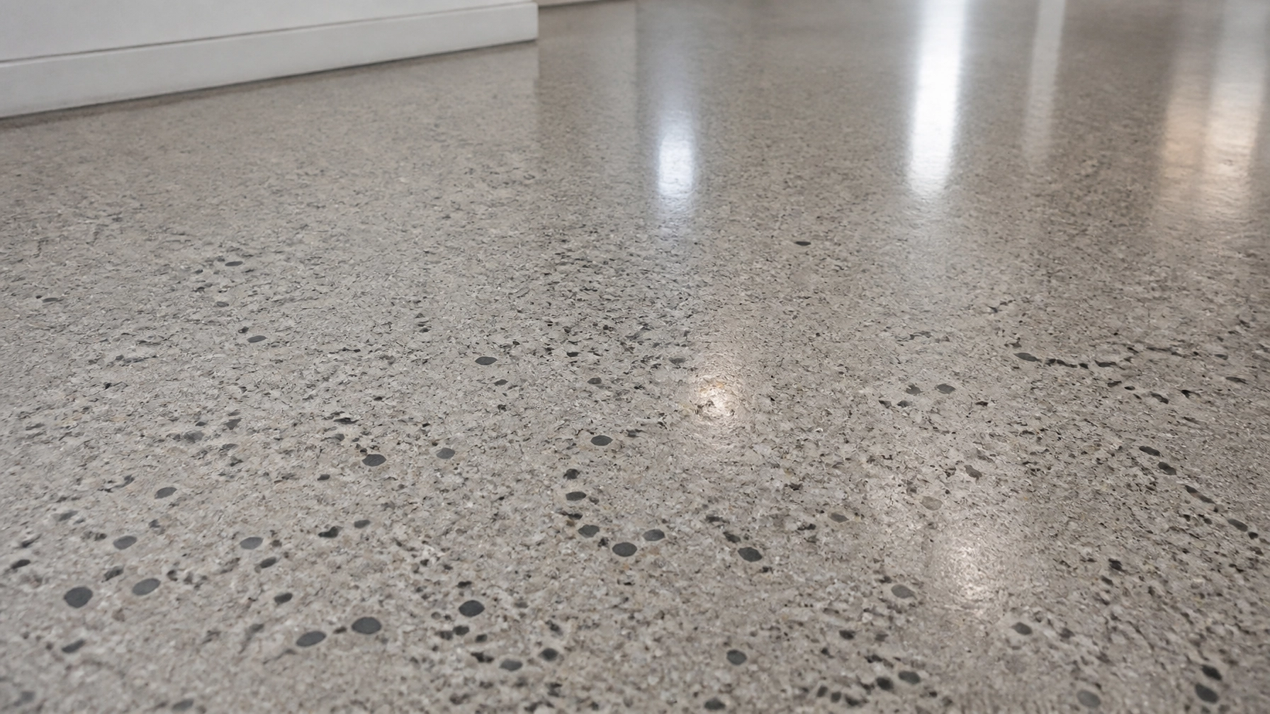 Class B salt-and-pepper aggregate exposure on a polished concrete surface
