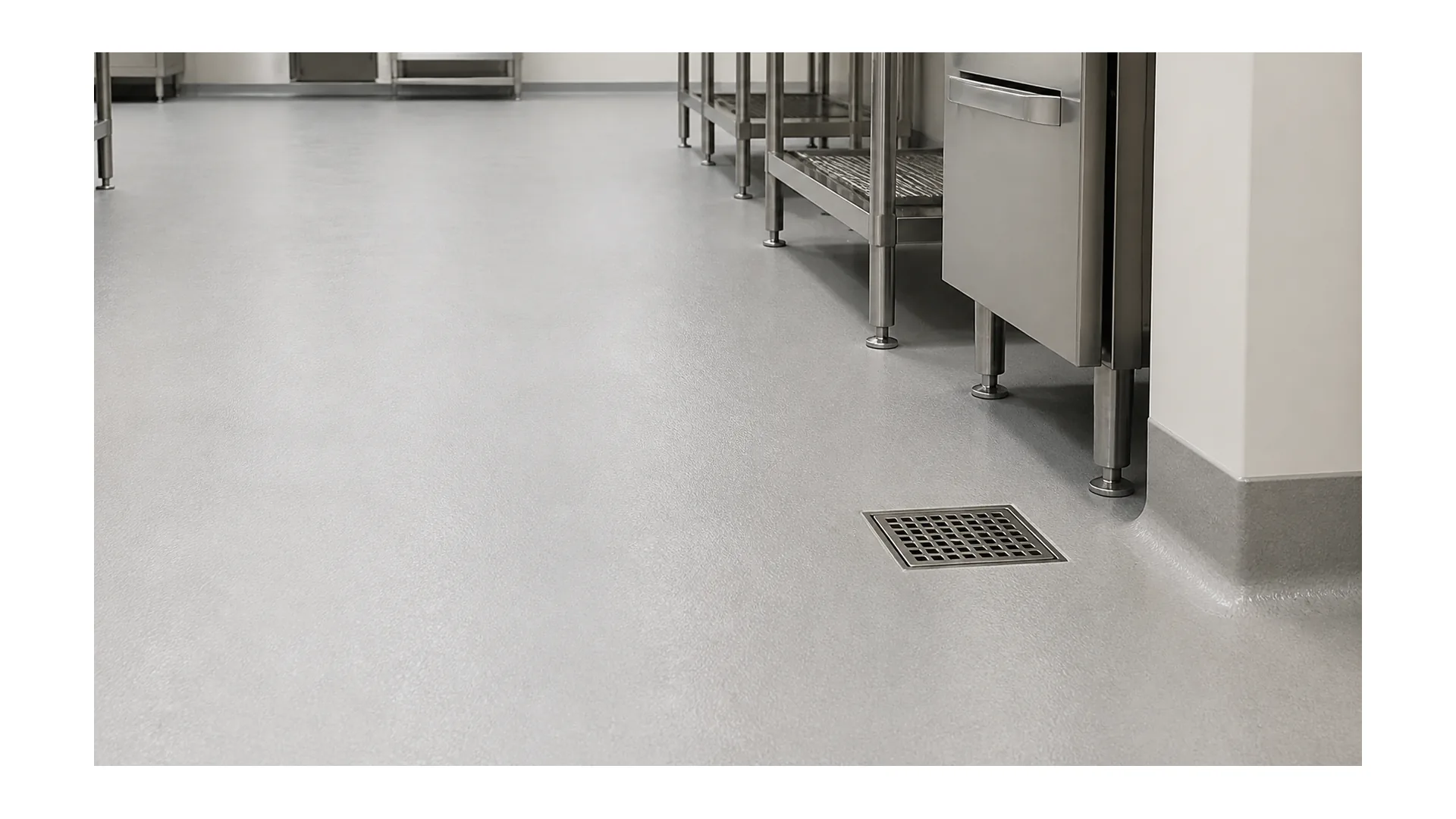 Commercial kitchen resinous flooring with cove base and floor drain detail